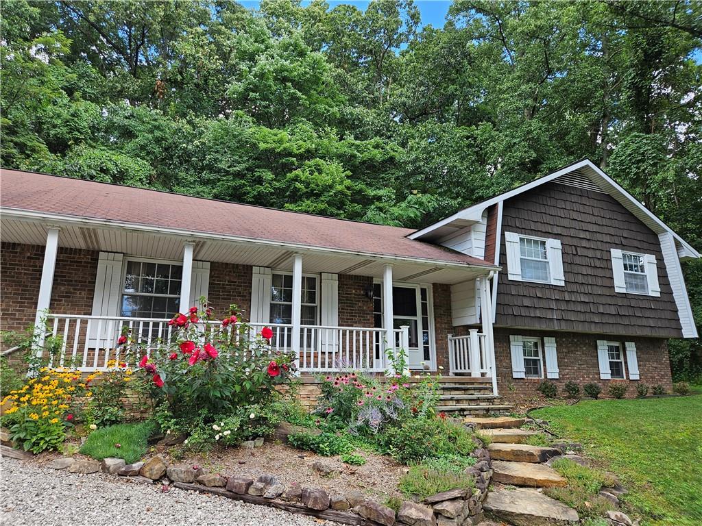a front view of a house with garden