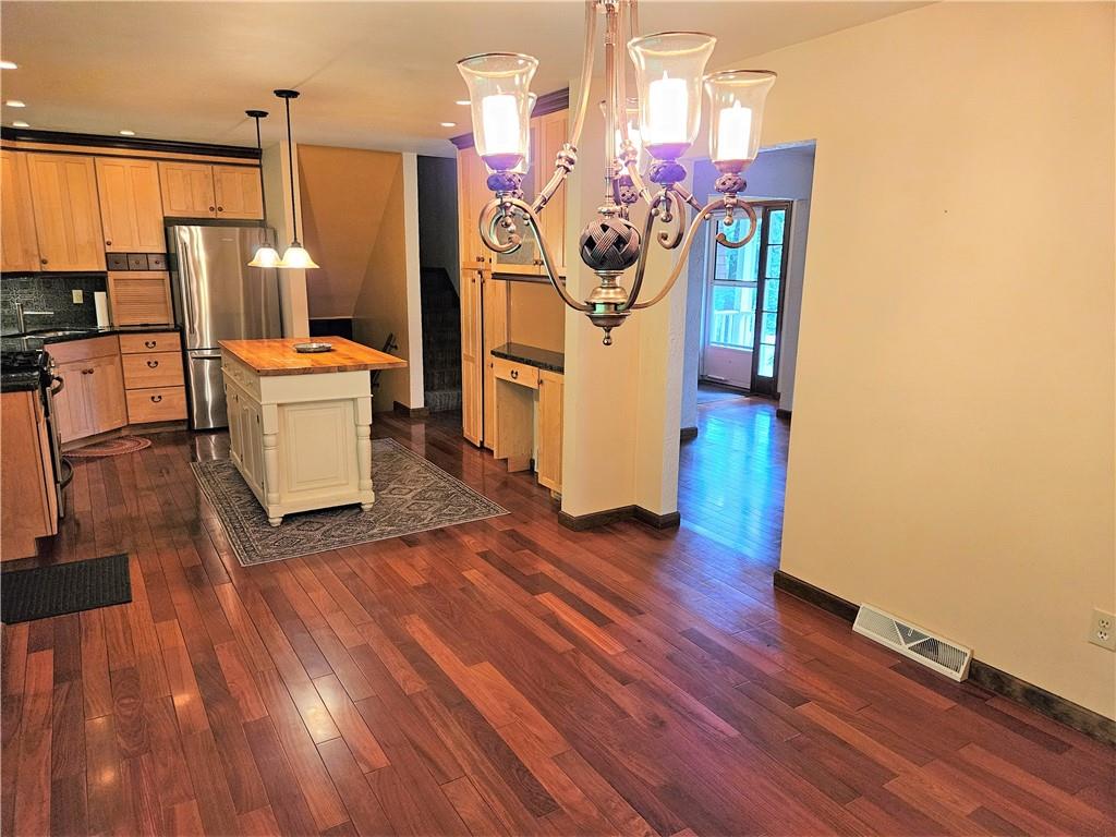 207 College Lodge Road Indiana, PA 15701 - Photo 12 of 36 a view of a kitchen with refrigerator and wooden floor