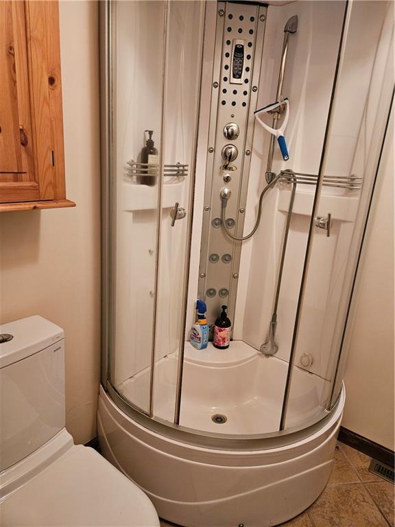207 College Lodge Road Indiana, PA 15701 - Photo 20 of 36 a bathroom with a toilet and shower