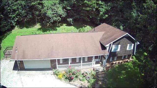 207 College Lodge Road Indiana, PA 15701 - Photo 5 of 36 a aerial view of a house with a yard and potted plants