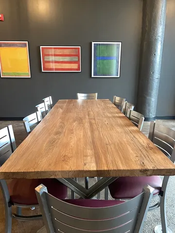 a bed sitting in a bedroom and table