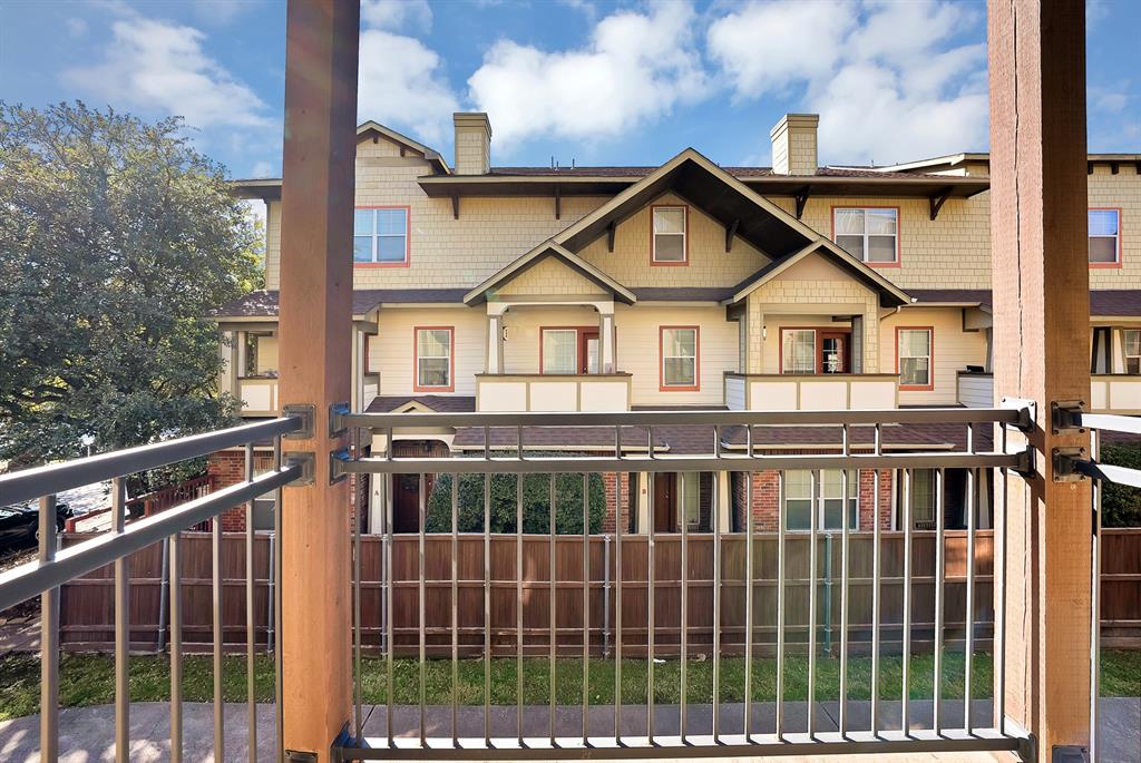 5747 Prospect Avenue, Unit B Dallas, TX 75206 - Photo 14 of 40 a view of a house with a wooden deck and a yard