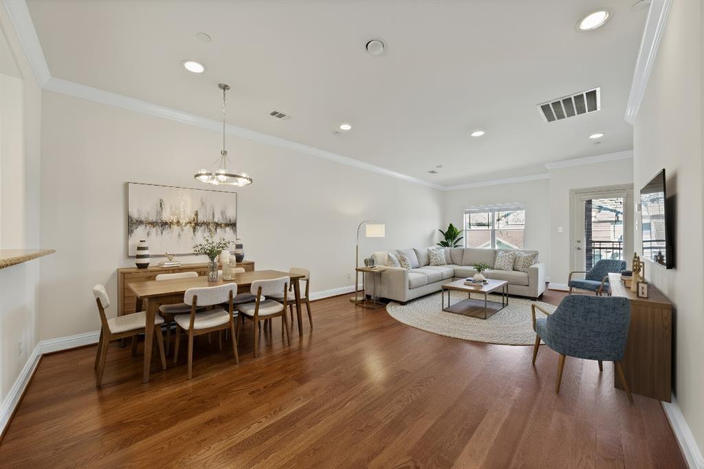 5747 Prospect Avenue, Unit B Dallas, TX 75206 - Photo 21 of 40 a view of a dining room with furniture and wooden floor