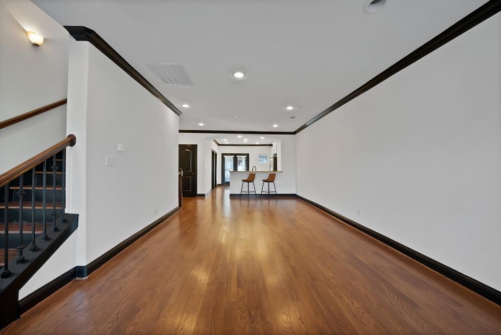 5747 Prospect Avenue, Unit B Dallas, TX 75206 - Photo 21 of 39 a view of empty room with wooden floor and fan