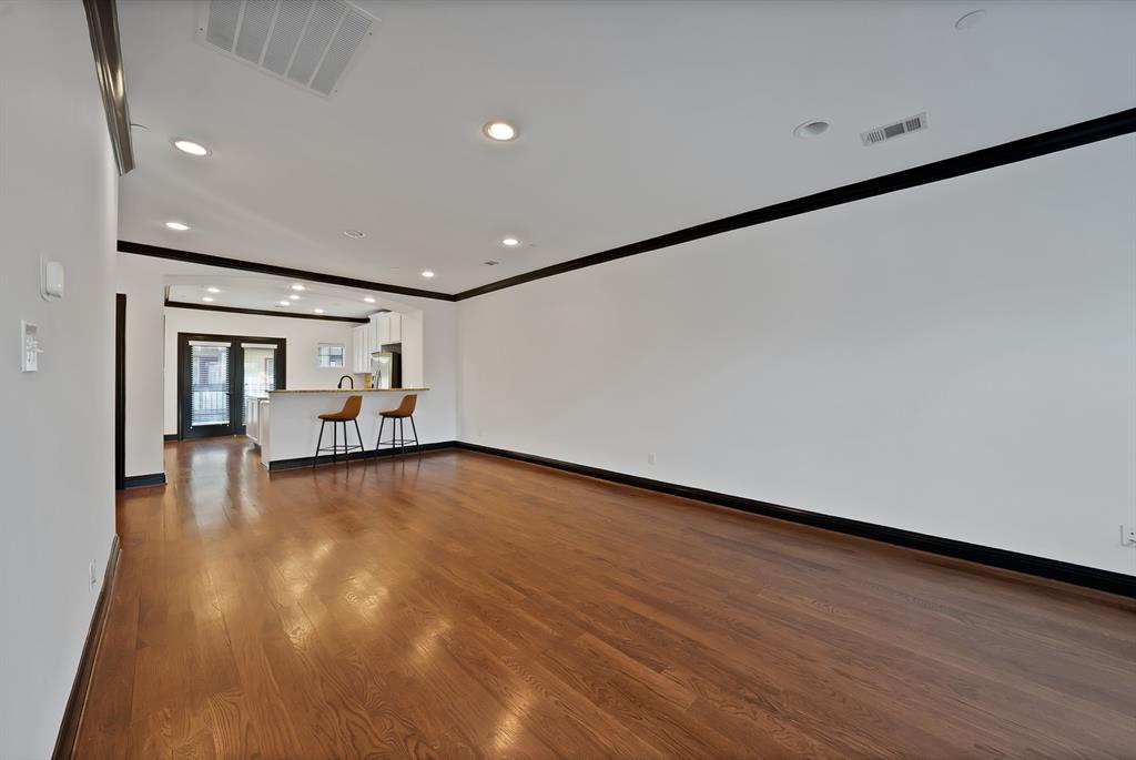 5747 Prospect Avenue, Unit B Dallas, TX 75206 - Photo 22 of 39 a view of empty room with wooden floor