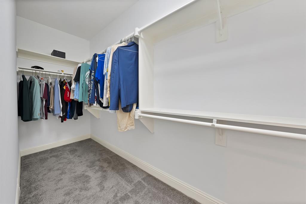 5747 Prospect Avenue, Unit B Dallas, TX 75206 - Photo 30 of 40 a view of walk in closet with clothes