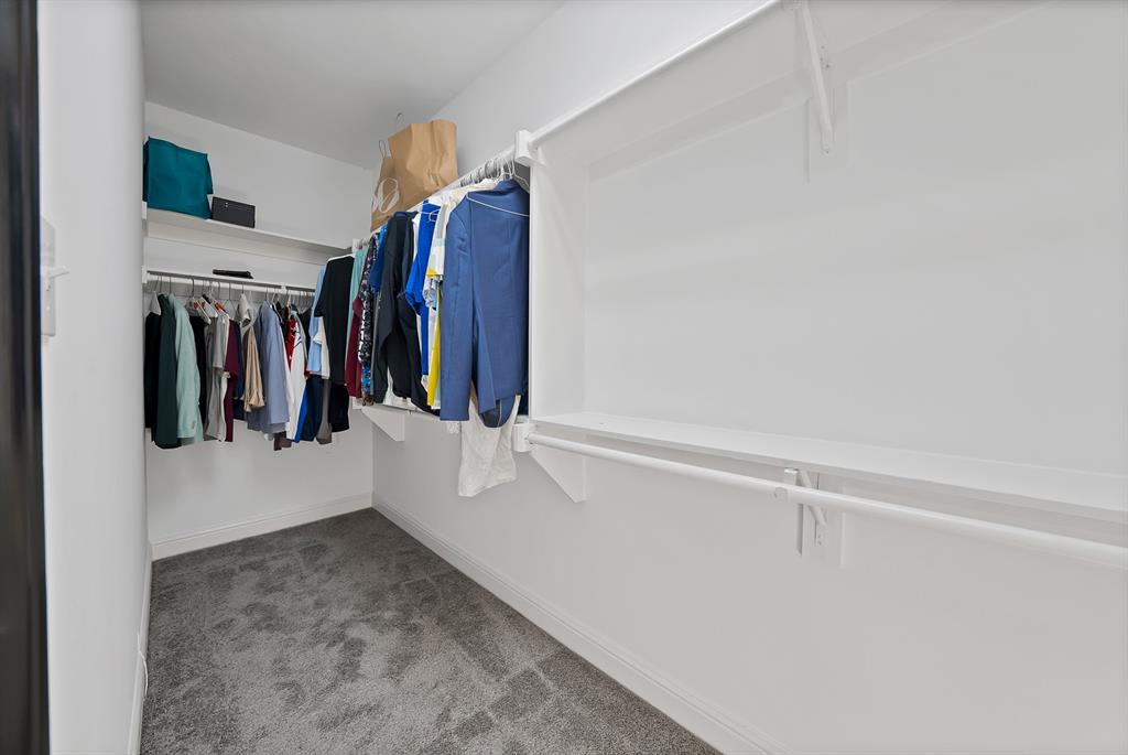 5747 Prospect Avenue, Unit B Dallas, TX 75206 - Photo 33 of 39 a view of walk in closet with clothes