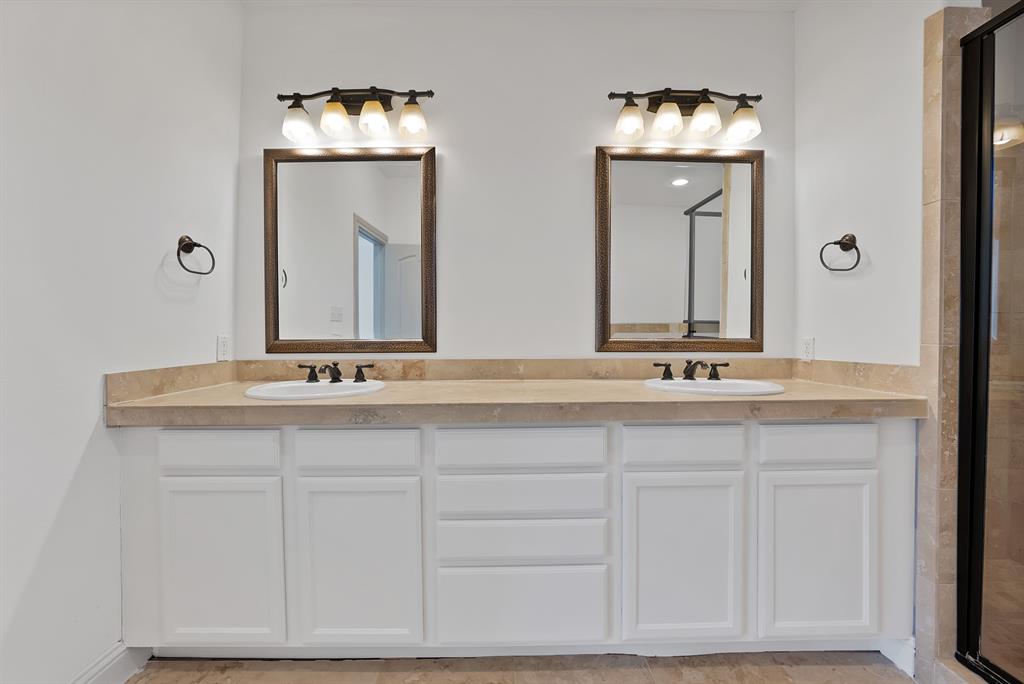 5747 Prospect Avenue, Unit B Dallas, TX 75206 - Photo 34 of 40 a bathroom with a sink vanity and a mirror