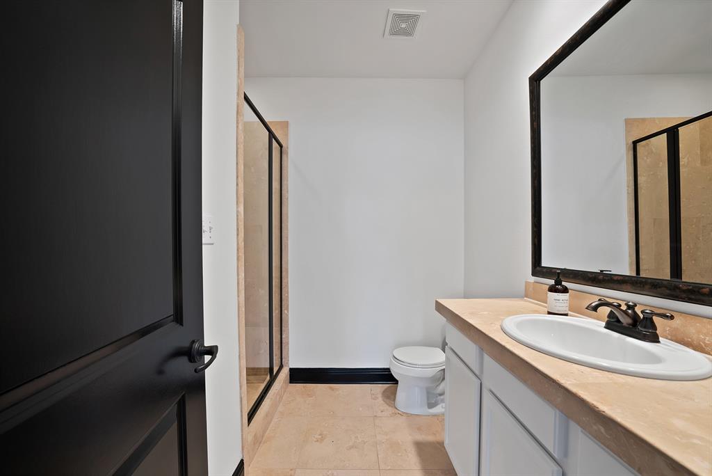 5747 Prospect Avenue, Unit B Dallas, TX 75206 - Photo 9 of 39 a bathroom with a sink a toilet and shower