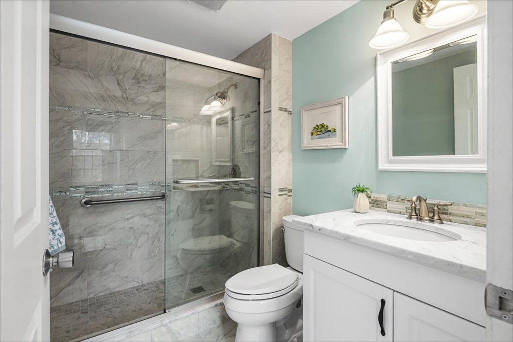 74 Thistle Patch Way, Unit 74 Hingham, MA 02043 - Photo 15 of 22 a bathroom with a sink toilet and shower