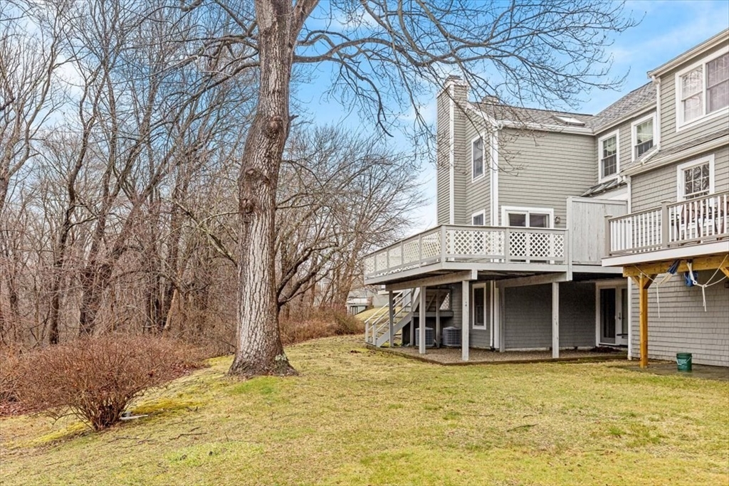 74 Thistle Patch Way, Unit 74 Hingham, MA 02043 - Photo 21 of 22 a view of a house with a yard