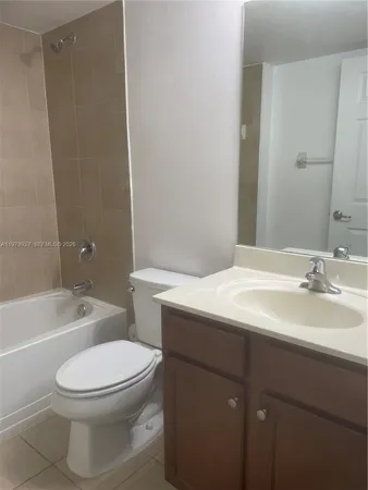 a bathroom with a sink a toilet and bathtub