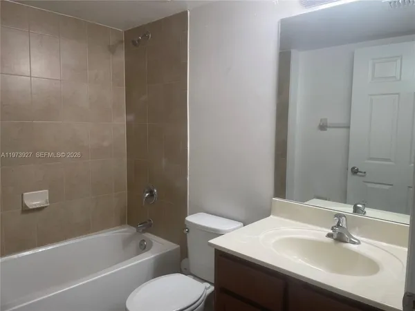 a bathroom with a sink toilet and bathtub