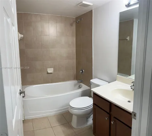 a bathroom with a toilet a sink and bathtub