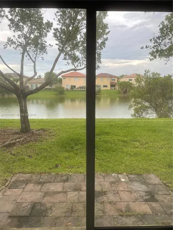 a view of a lake with a big yard