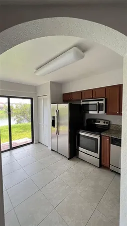 a view of an empty room with a stove