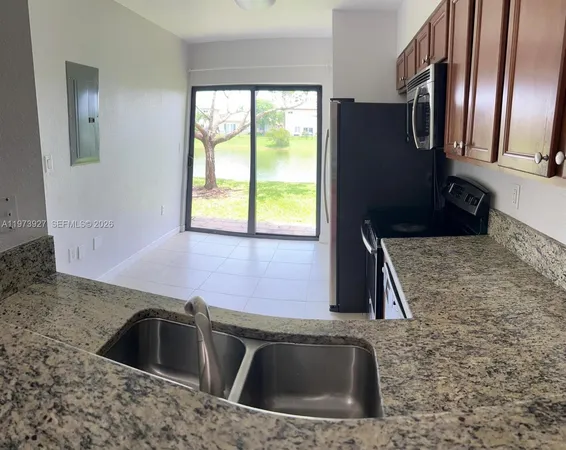 a kitchen that has a sink and a window