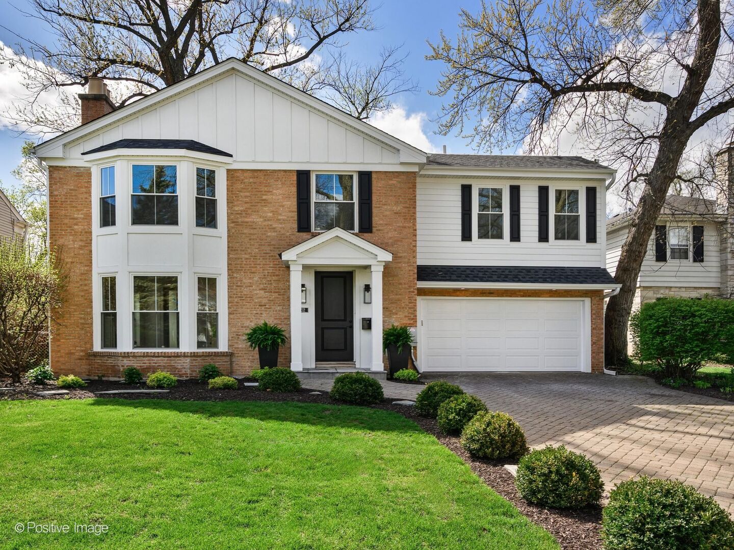 915 Pontiac Road Wilmette, IL 60091 - Photo 1 of 2 a front view of a house with a garden and plants