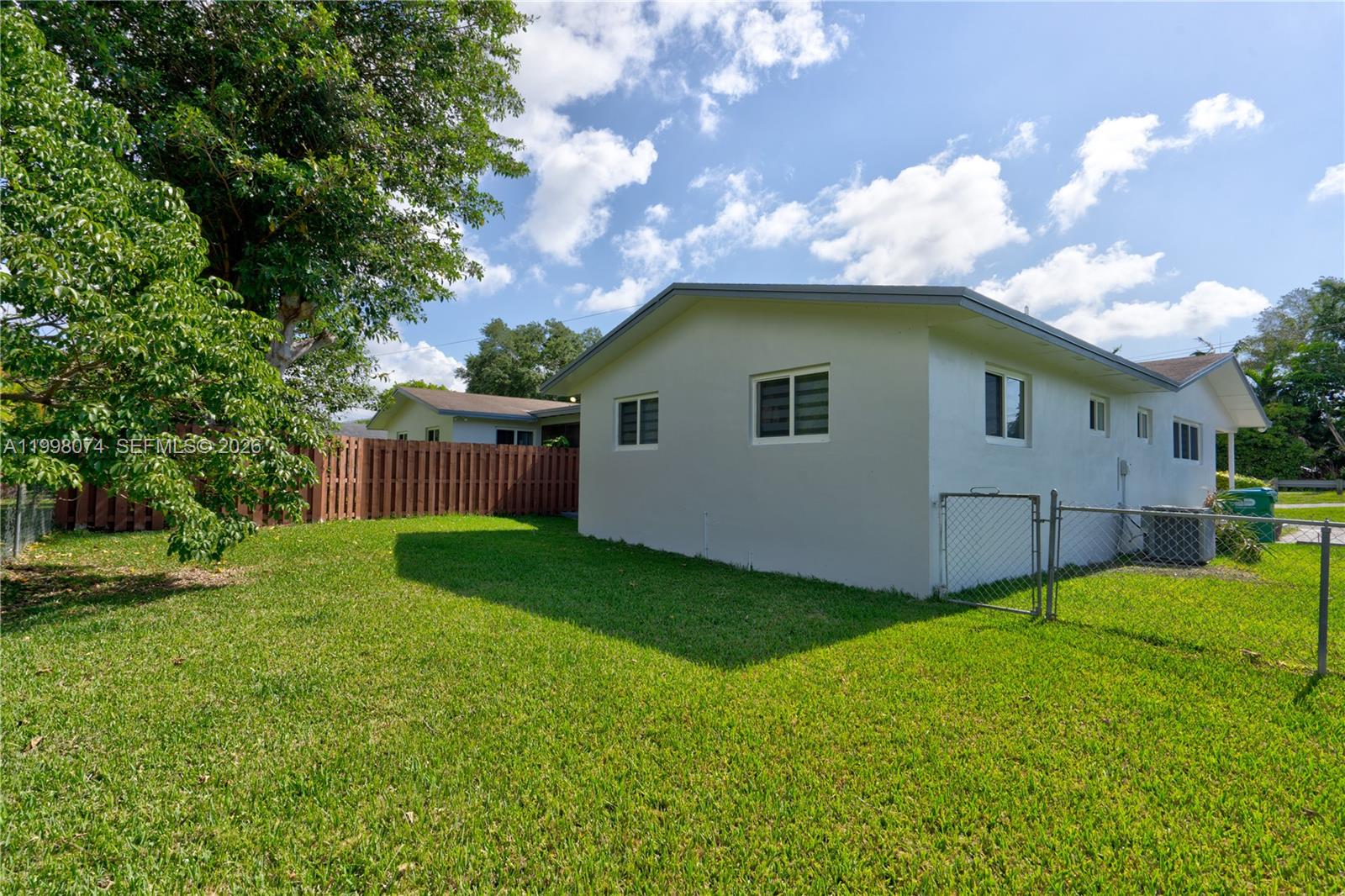 Pinecrest Pinecrest, FL 33156 - Photo 2 of 9 a backyard of a house with lots of green space