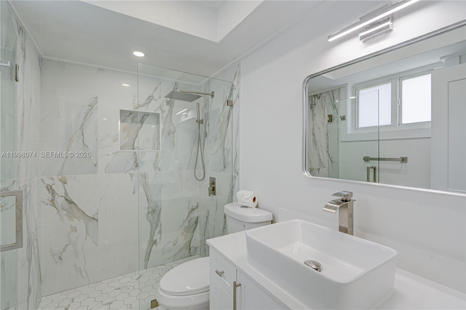 Pinecrest Pinecrest, FL 33156 - Photo 7 of 9 a bathroom with a sink toilet and shower