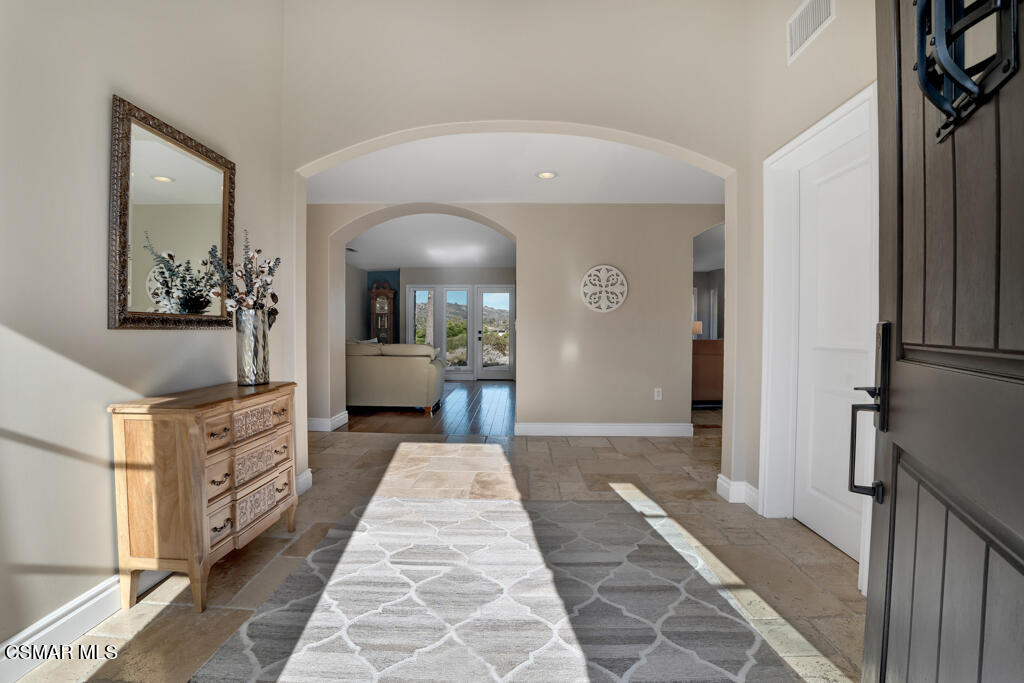 1660 San Rafael Way Camarillo, CA 93012 - Photo 12 of 63 a hall way with furniture a mirror and a rug