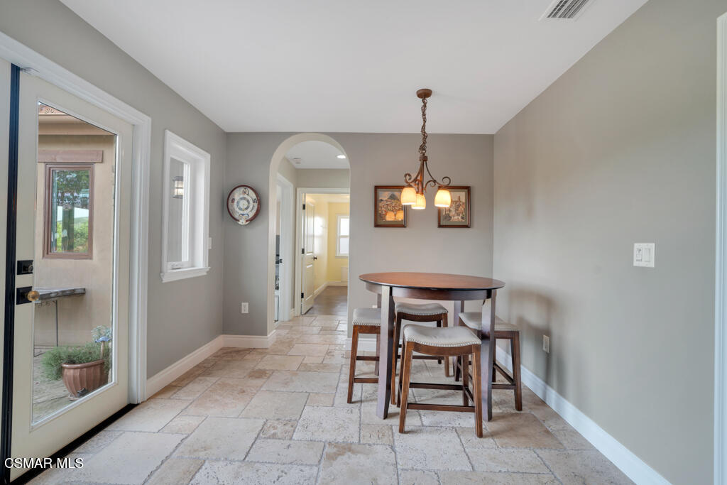 1660 San Rafael Way Camarillo, CA 93012 - Photo 18 of 63 a view of a kitchen with a table and chairs