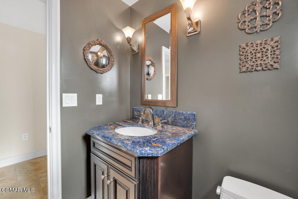 1660 San Rafael Way Camarillo, CA 93012 - Photo 21 of 63 a bathroom with a granite countertop sink and a mirror