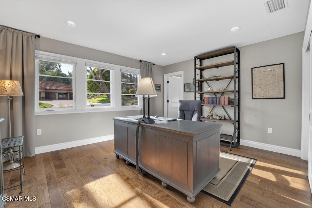 1660 San Rafael Way Camarillo, CA 93012 - Photo 22 of 63 a kitchen with kitchen island a counter top space a sink and cabinets
