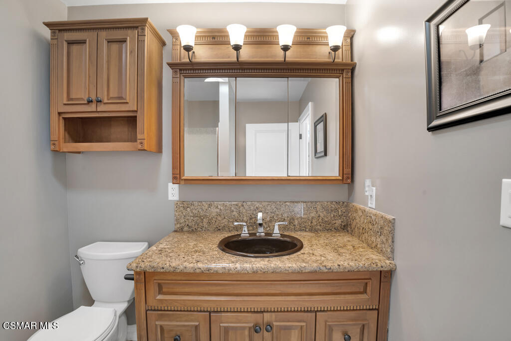 1660 San Rafael Way Camarillo, CA 93012 - Photo 23 of 63 a bathroom with a granite countertop sink and a mirror