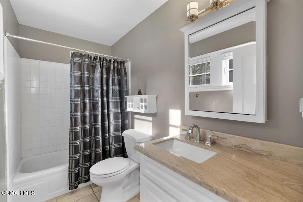 1660 San Rafael Way Camarillo, CA 93012 - Photo 27 of 63 a bathroom with a granite countertop sink toilet a mirror and shower