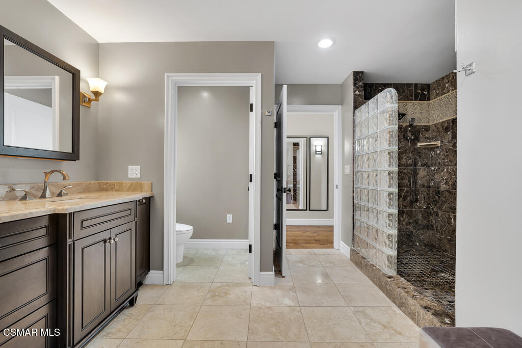 1660 San Rafael Way Camarillo, CA 93012 - Photo 34 of 63 a bathroom with a granite countertop sink a toilet and shower