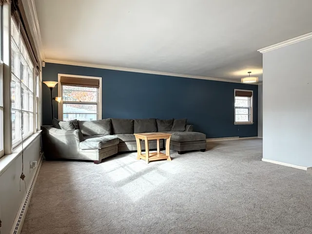a living room with furniture and windows