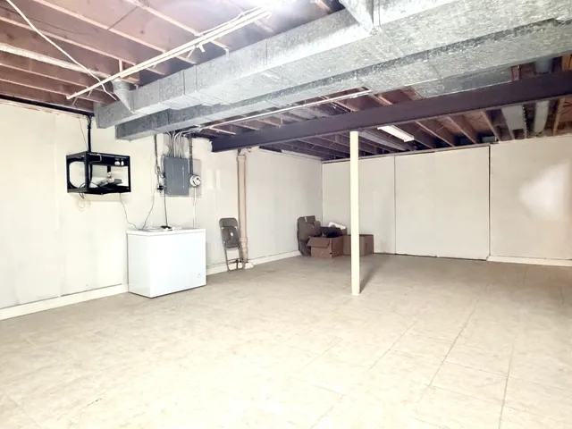 a view of a room with wooden walls