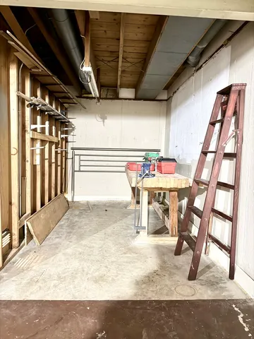 a view of an chairs and table in the room