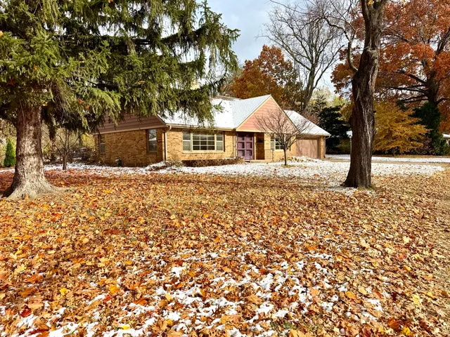 front view of house with a trees