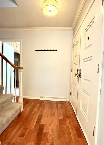 a view of a room with wooden floor and small space