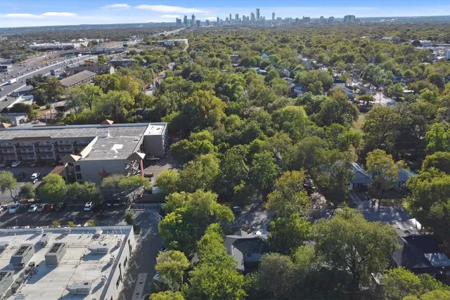 an aerial view of a town with trees