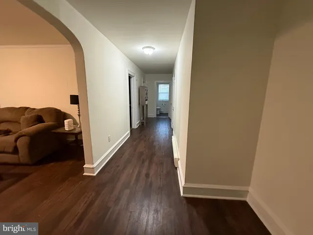 a view of a livingroom with wooden floor