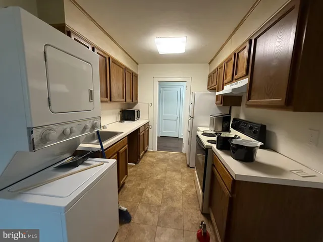 a kitchen that has a sink and a stove