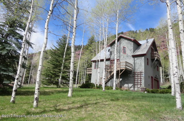 a view of house with yard