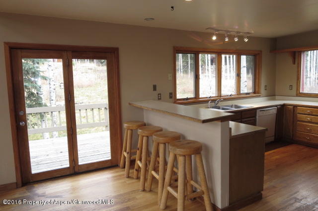 95 Chair Mountain Drive Redstone, CO 81623 - Photo 14 of 20 a kitchen with a sink and large window