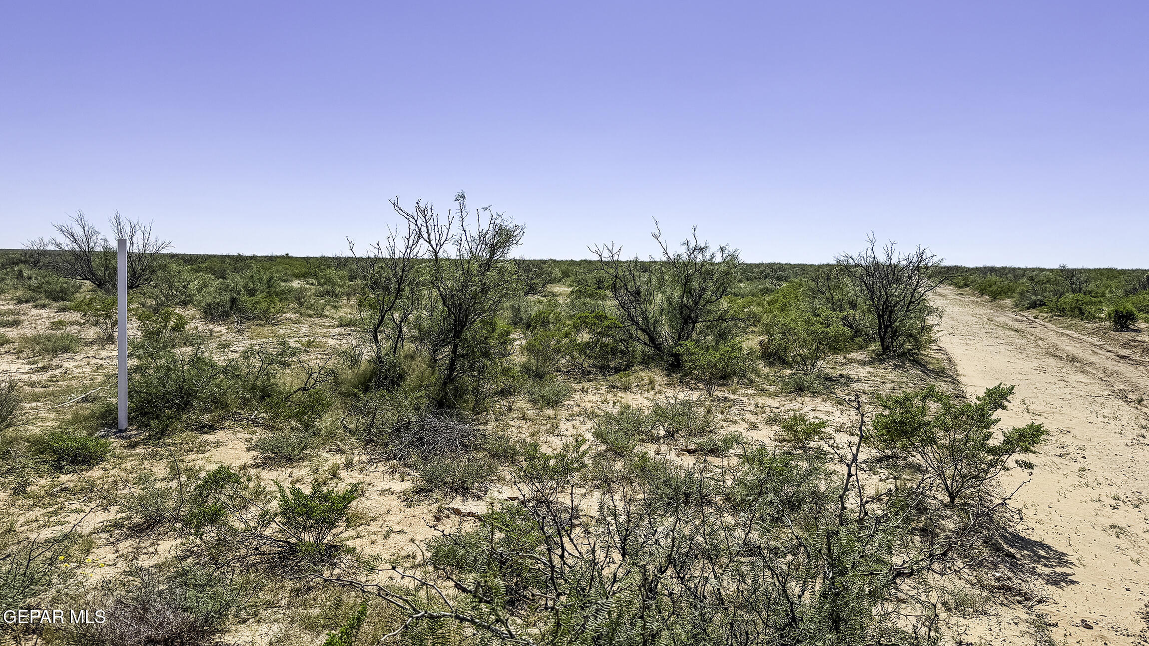 76041-2 Pn Ranch, Unit 617 Sierra Blanca, TX 79851 - Photo 16 of 28 a view of a lake with houses in the back