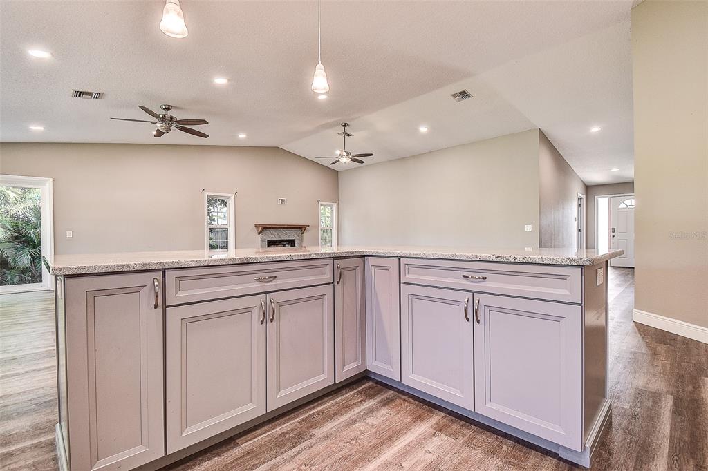 289 Whisper Lake Road Palm Harbor, FL 34683 - Photo 18 of 40 a kitchen with white cabinets and sink