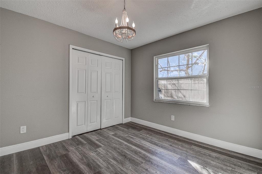 289 Whisper Lake Road Palm Harbor, FL 34683 - Photo 23 of 40 a view of an empty room with a window