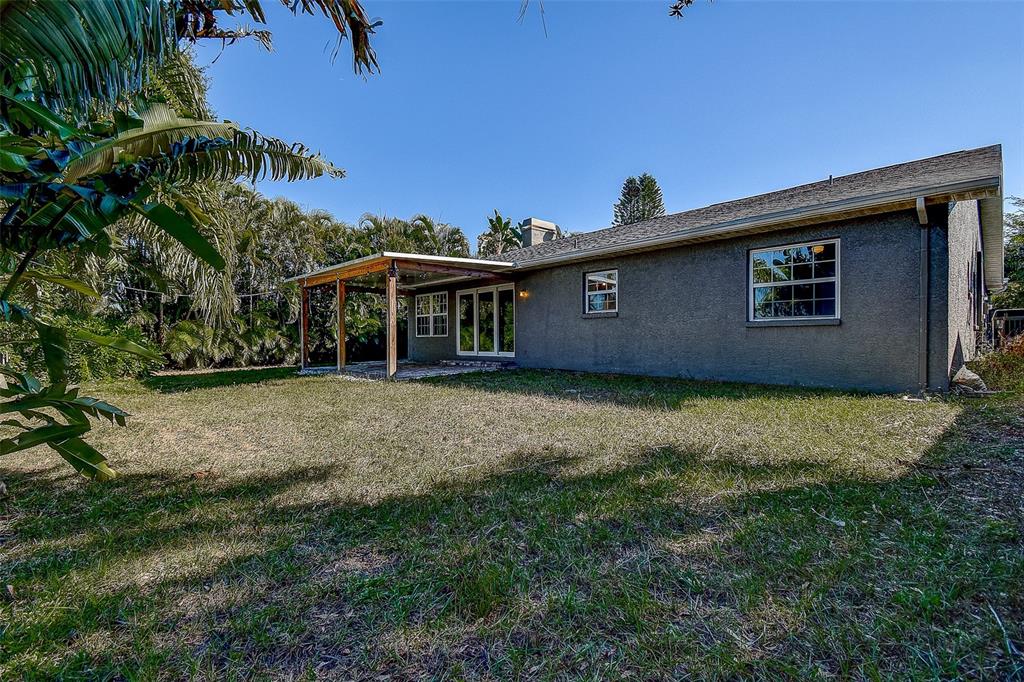 289 Whisper Lake Road Palm Harbor, FL 34683 - Photo 29 of 40 a front view of a house with a yard