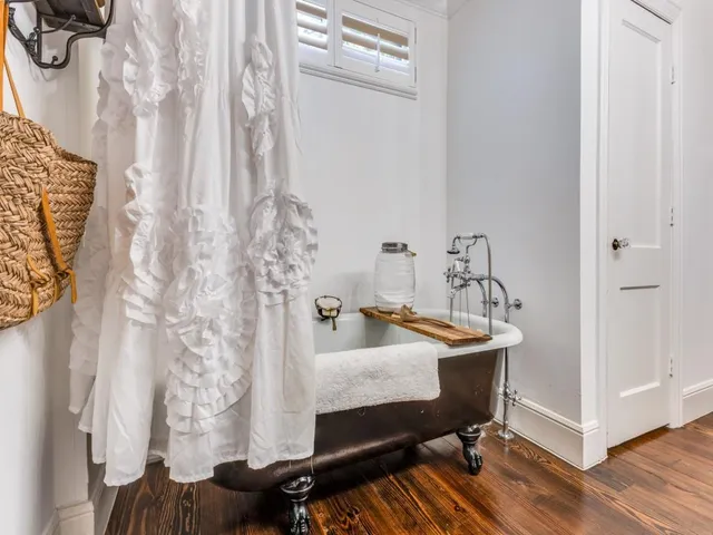 a bathroom with a sink vanity granite and a mirror