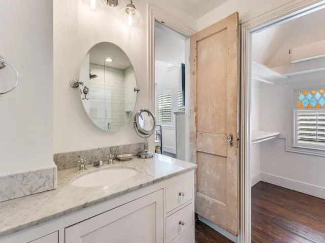 a bathroom with a shower toilet and sink