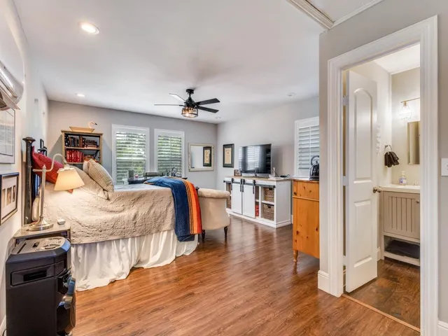 a bathroom with a shower a sink and a mirror