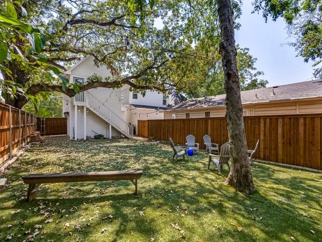 a view of a garden with a deck