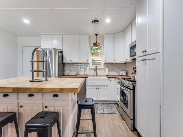 a bedroom with a bed and a couch